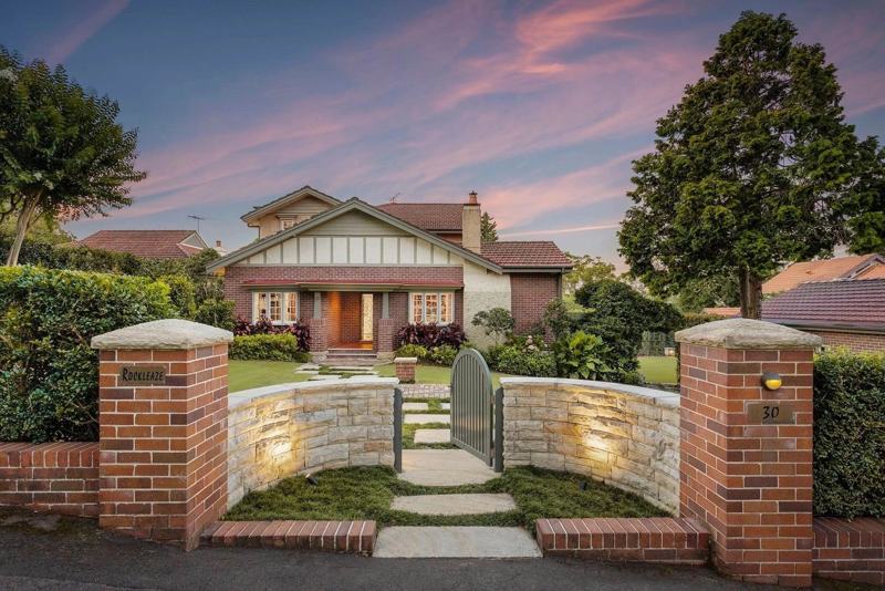 Federation home with a new face brick and sandstone front fence