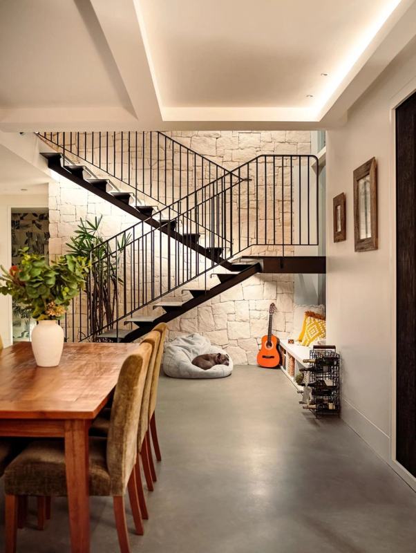 Internal sandstone feature wall in an open-plan living and dining room
